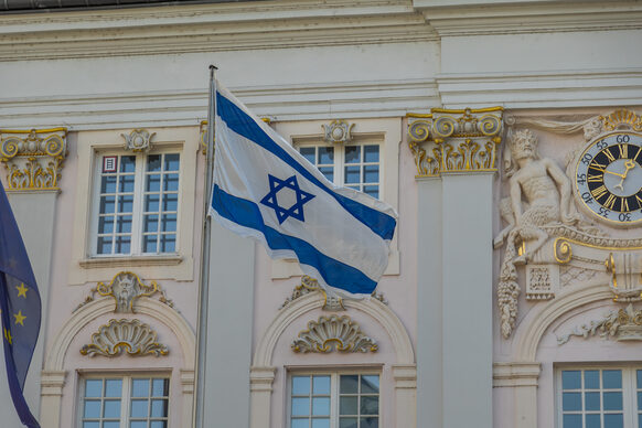 Israeli national flag is hoisted in front of the Old Town Hall