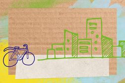 Die Zeichnung zeigt ein Fahrrad und mehrere Häuser