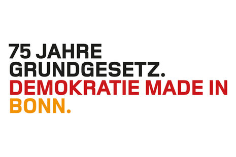 Das Logo zeigt in schwarz-rot-goldener Schrift den Text 75 Jahre Grundgesetz. Demokratie made in Bonn
