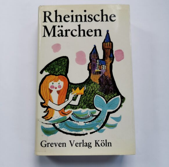 Buch "Rheinische Märchen" vom Greven Verlag Köln mit einer Meerjungfrau und einer Burg auf dem Cover.