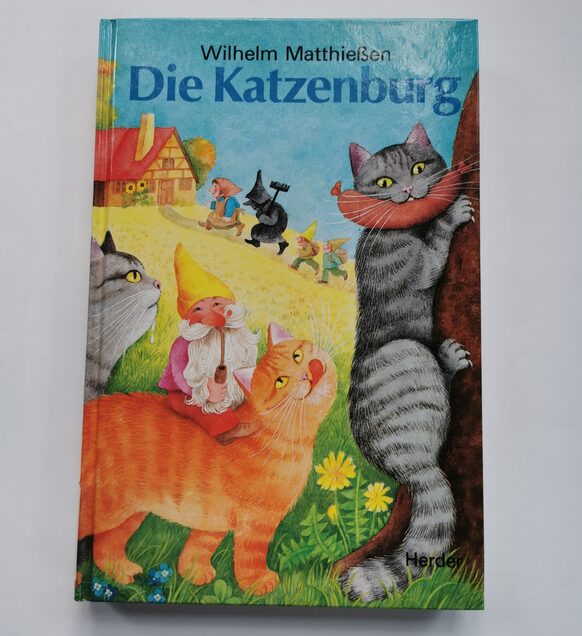 Buch "Die Katzenburg" von Wilhelm Matthießen, Buntes Cover mit Katzen.