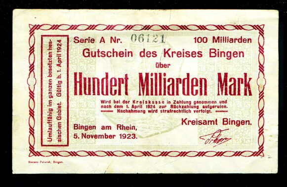 Das Bild zeigt einen gelblichen Geldschein mit roter Schrift über Hundert Milliarden Mark von 1923.